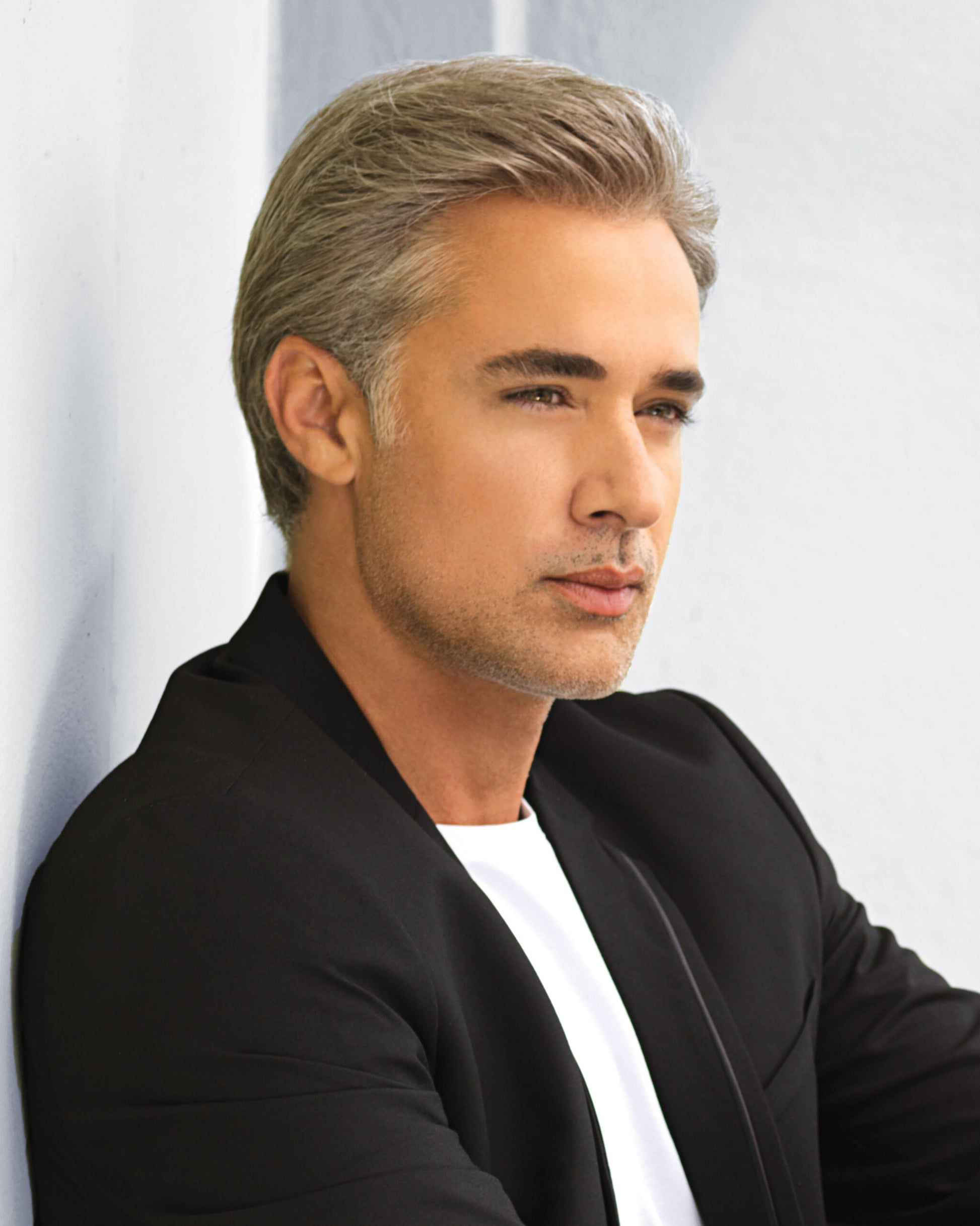 HairUWear realistic men's wigs for thinning hair styled salt and pepper short side part on male model