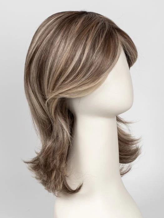 Raquel Welch Goddess wig shoulder length layered light brown with blonde highlights and side swept fringe on mannequin