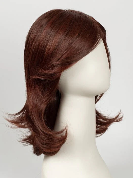 First Lady Products Raquel Welch Goddess wig in auburn layered medium length with side swept bangs and flipped ends