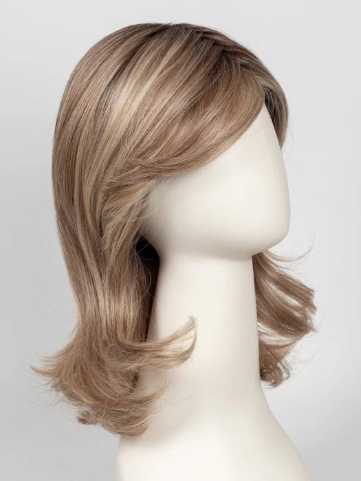 Raquel Welch Goddess wig mid length layered light brown with blonde highlights and flipped ends on mannequin
