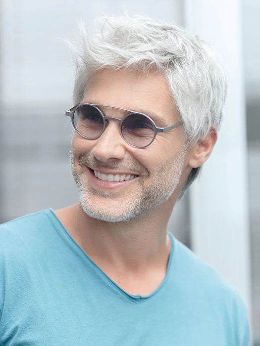 Smiling man wearing Ellen Wille George men's wig in silver short textured style with sunglasses and light stubble
