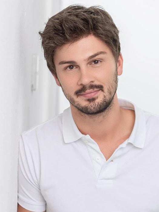 Male model wearing Ellen Wille Steven Sport wig short tousled brown hair with natural hairline in white polo