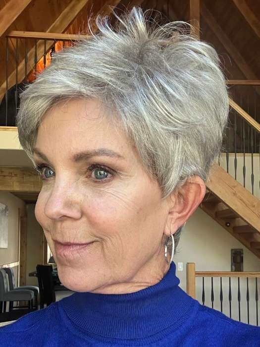Ellen Wille Tab wig short silver textured pixie on mature model side profile in blue turtleneck indoors