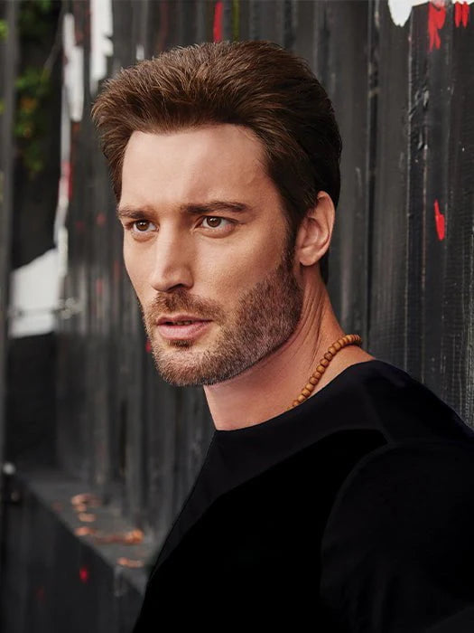 HairUWear men's natural look wig medium brown textured style on model with stubble wearing black shirt and necklace