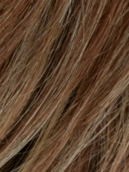 Close-up view of a human hair wiglet for thinning hair in natural brown shades with subtle highlights