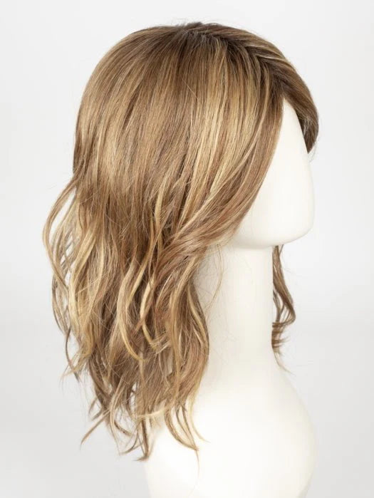 Medium length synthetic wig in a light brown color with soft waves and natural layers