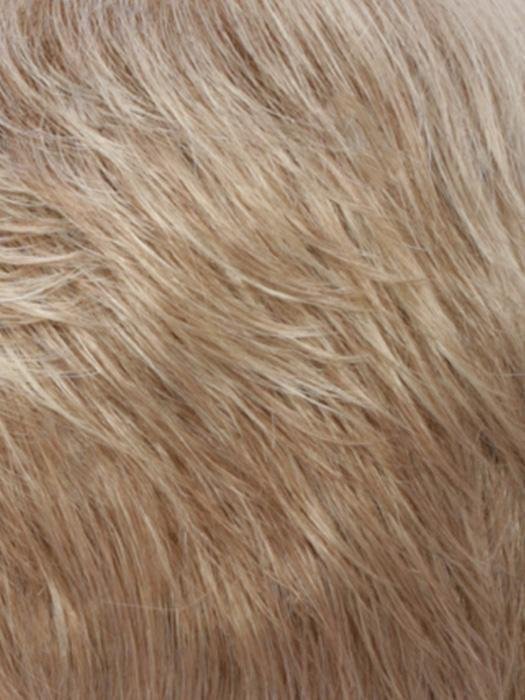 Close-up view of a monofilament hair topper for thinning hair in a light blonde shade