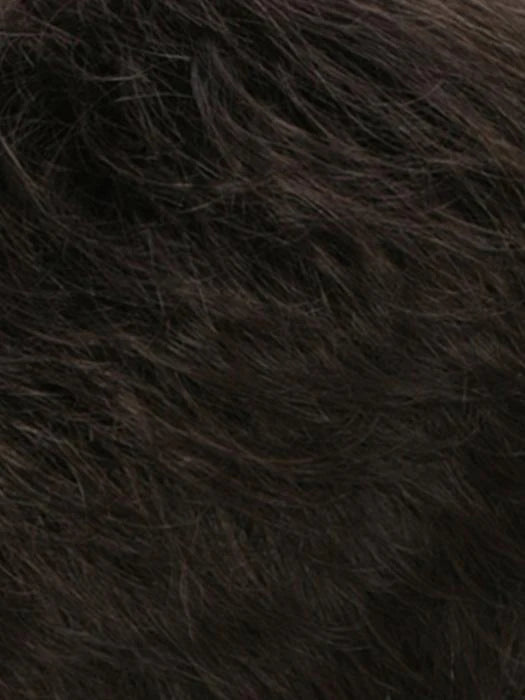 Close-up of a dark monofilament hair topper for thinning hair, featuring a natural look and soft texture