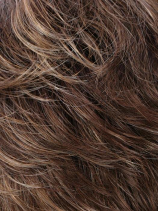 Close-up view of a natural-looking monofilament hair topper for thinning hair in various brown tones