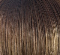 Zara wig by Rene of Paris in chestnut brown with honey highlights close up showing straight smooth synthetic hair fibers