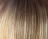 Close up of rooted brown to blonde hair color on Zara wig by Rene of Paris showing natural highlights