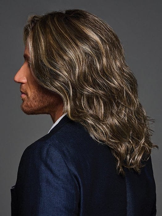 Admirable HIM wig for men. Long wavy brown highlighted wig on male model in navy blazer